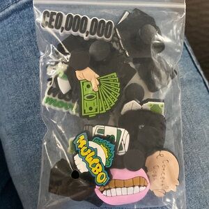 21 assorted Money maker croc charms